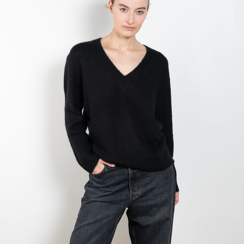 The Leona Sweater by Lisa Yang is a V-neck sweater with dropped shoulders in a textured cashmere silk