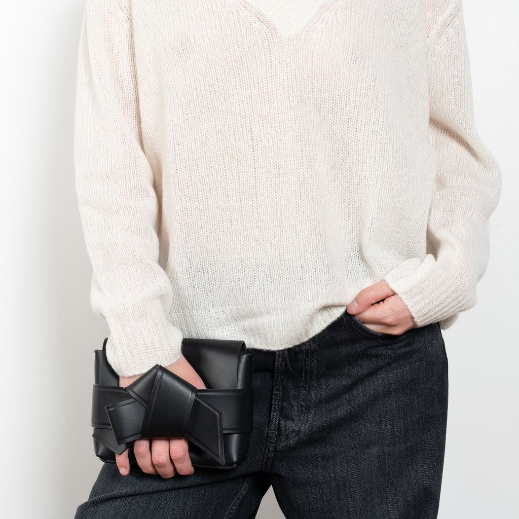 The Leona Sweater by Lisa Yang is a V-neck sweater with dropped shoulders in a textured cashmere silk&nbsp;