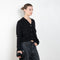 The Marionette Cardigan by Lisa Yang is a V-neck cardigan with a boxy fit in a soft textured cashmere silk