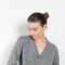 The Marionette Cardigan by Lisa Yang is a V-neck cardigan with a boxy fit in a soft textured cashmere silk