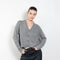 The Marionette Cardigan by Lisa Yang is a V-neck cardigan with a boxy fit in a soft textured cashmere silk