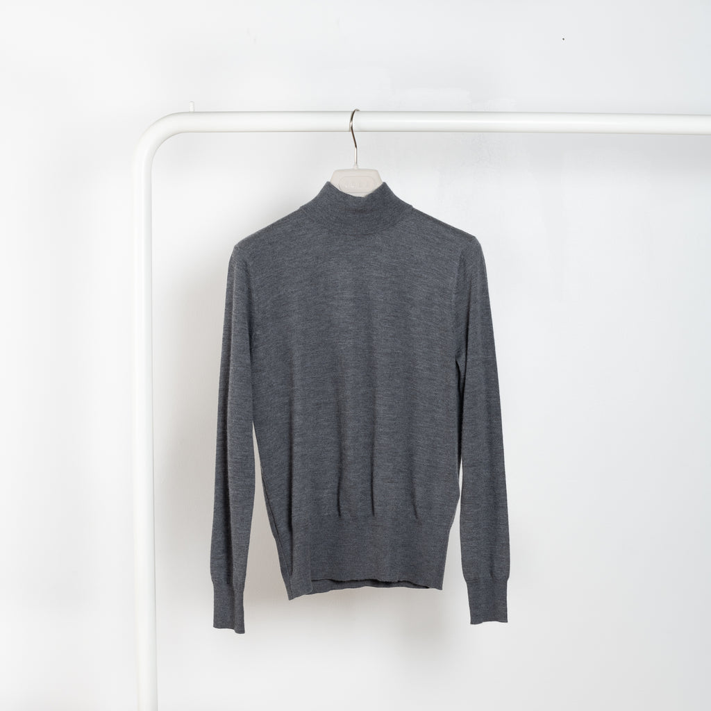 The Ophelia Sweater by Lisa Yang is a fine cashmere knit with a fitted shape and high neck