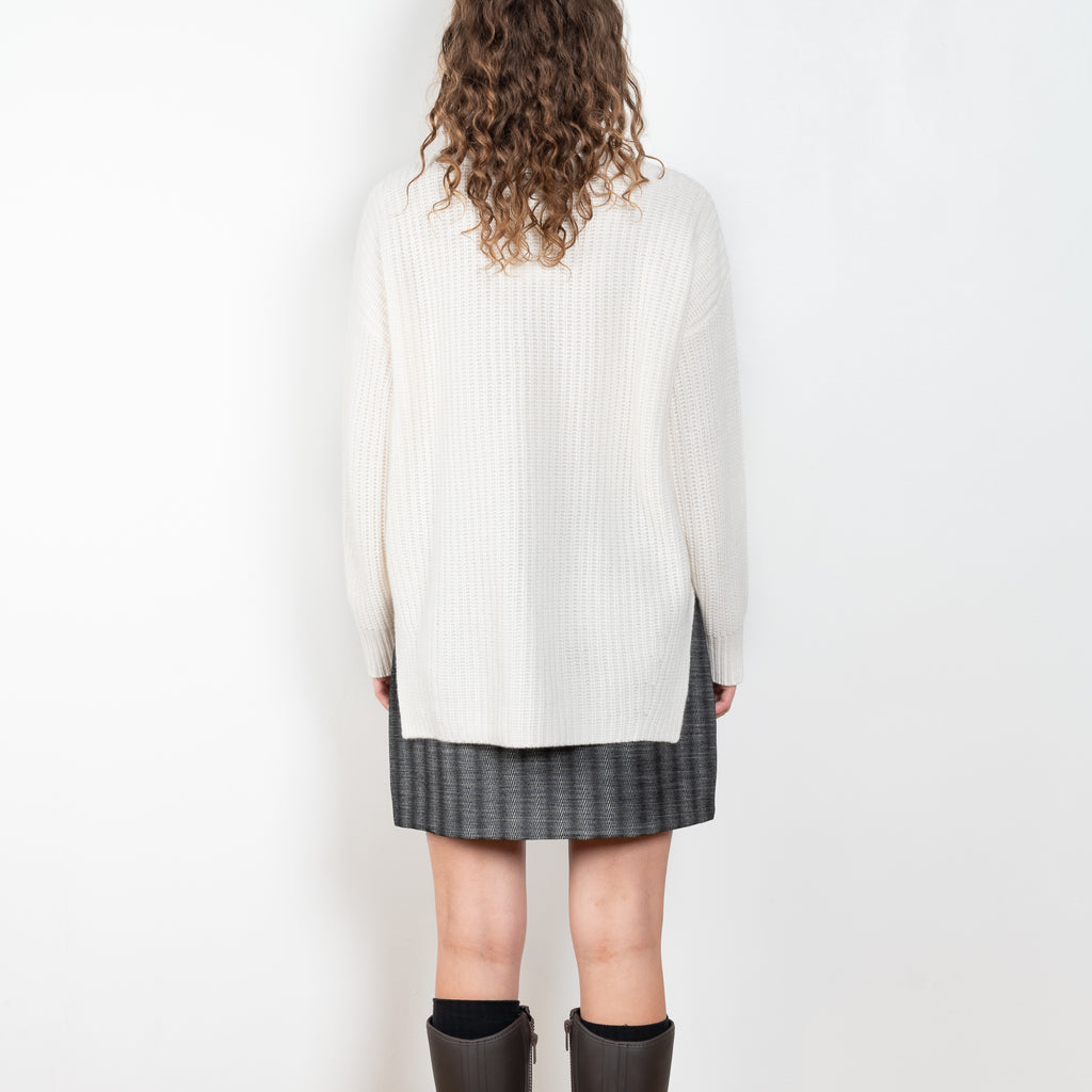 The Therese Sweater by Lisa Yang has a relaxed silhouette with a loose high neck