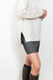 The Therese Sweater by Lisa Yang has a relaxed silhouette with a loose high neck