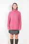 The Therese Sweater by Lisa Yang has a relaxed silhouette with a loose high neck