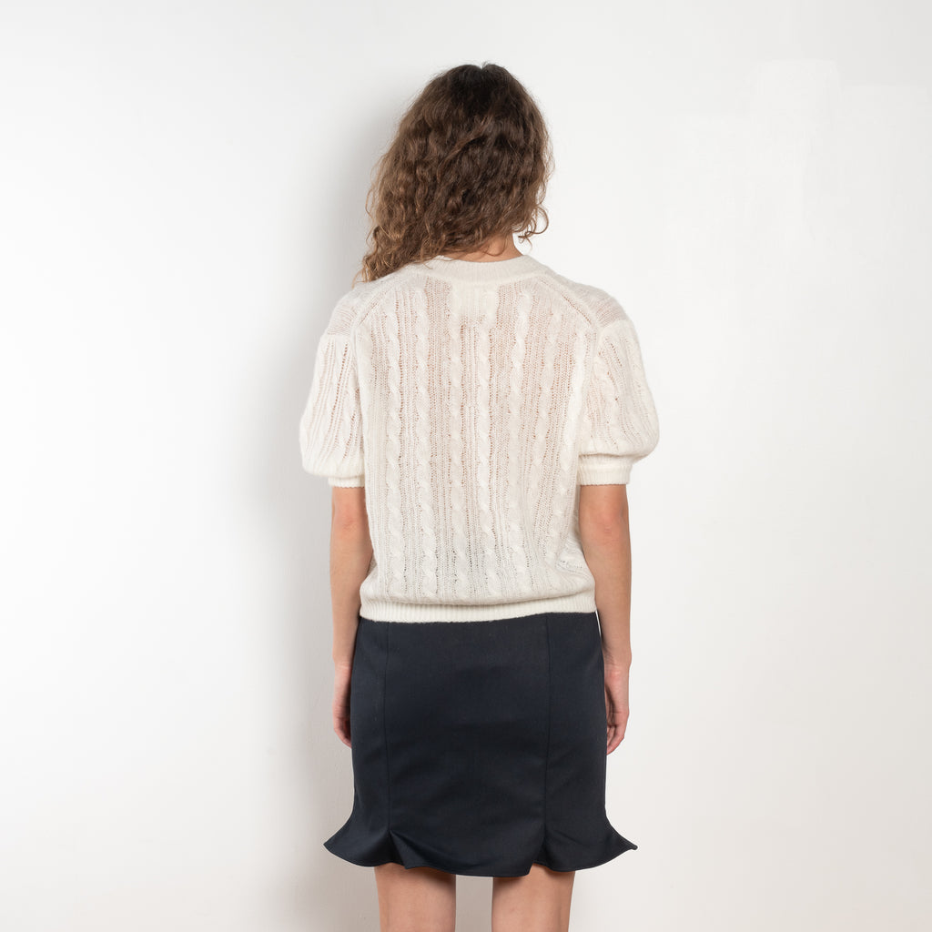 The Kenzie Sweater by Lisa Yang is a softly voluminous cable knit top in a delicate silk cashmere blend.