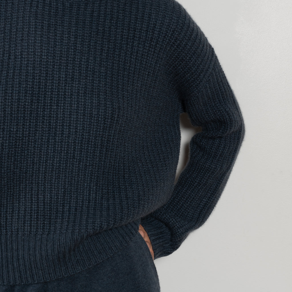 The Julina Sweater by LISA YANG is a chuncky cashmere ribbed sweater with a high neck and straight fit