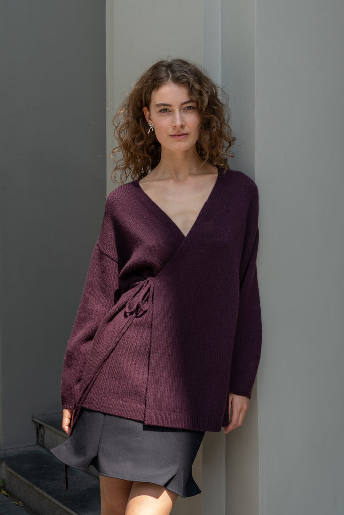The Laurina Wrap Cardigan is a refined and feminine cashmere knit wrap cardigan with a tied waist
