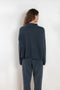 The Sandy Sweater by LISA YANG has a straight fit with dropped shoulders and a raw hem mock neck