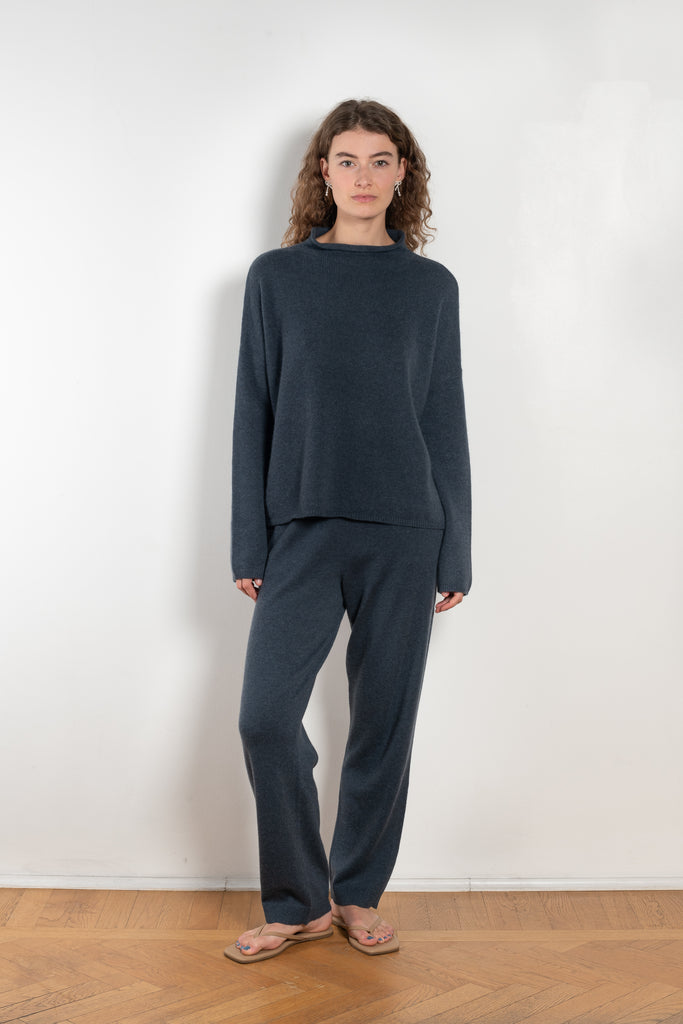 The Sandy Sweater by LISA YANG has a straight fit with dropped shoulders and a raw hem mock neck