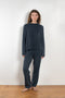 The Sandy Sweater by LISA YANG has a straight fit with dropped shoulders and a raw hem mock neck