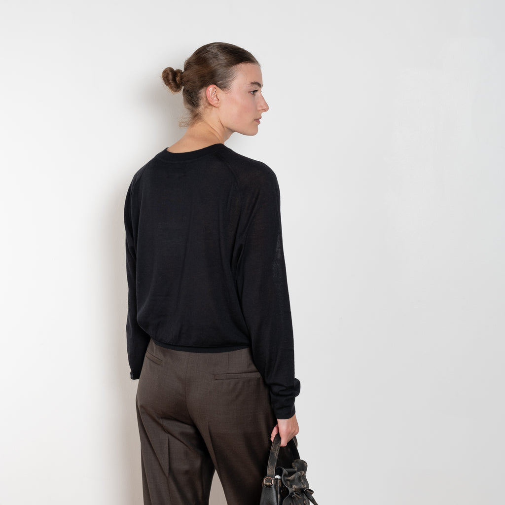 The Angus Sweater by Loulou Studio is fine cashmere knit with a round neck and effortless body, the perfect layering piece.