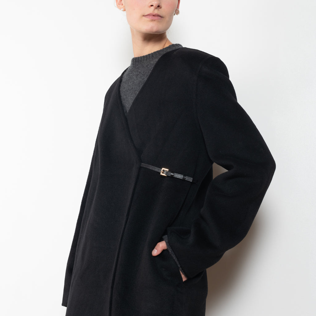 The Banie Coat by Loulou Studio is a straight coat with minimal lines and detailed with a fine leather strap