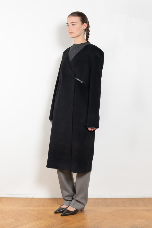 The Banie Coat by Loulou Studio is a straight coat with minimal lines and detailed with a fine leather strap