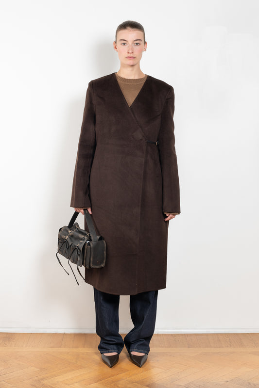 The Banie Coat by Loulou Studio is a straight coat with minimal lines and detailed with a fine leather strap