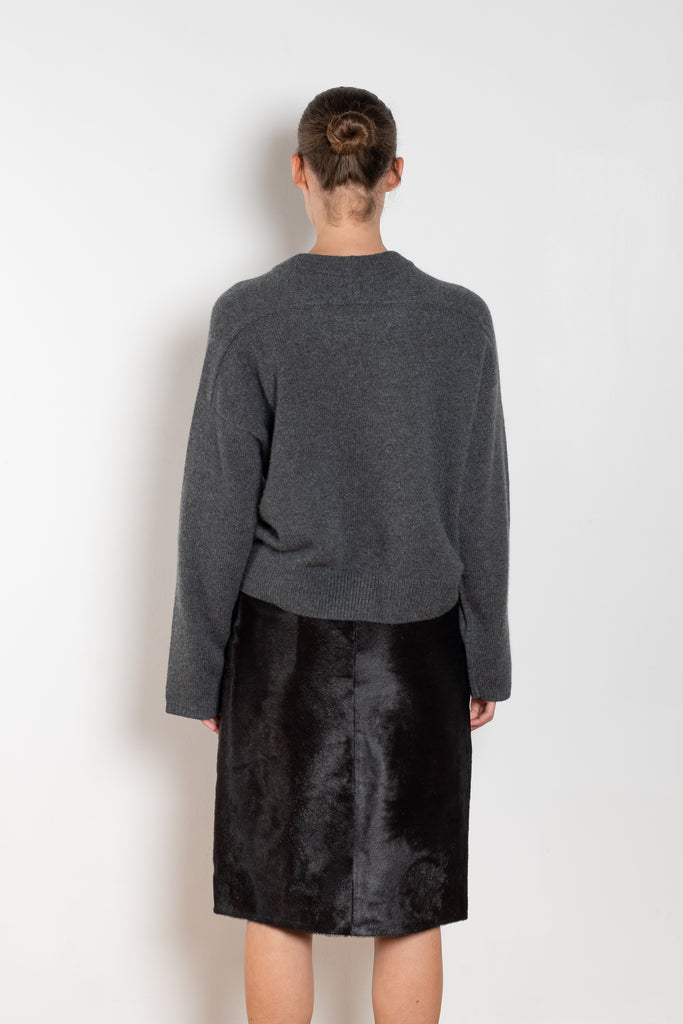 The Bill Sweater by Loulou Studio is thick soft cashmere sweater with a draped detail and an hardware embellishment