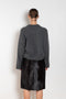 The Bill Sweater by Loulou Studio is thick soft cashmere sweater with a draped detail and an hardware embellishment