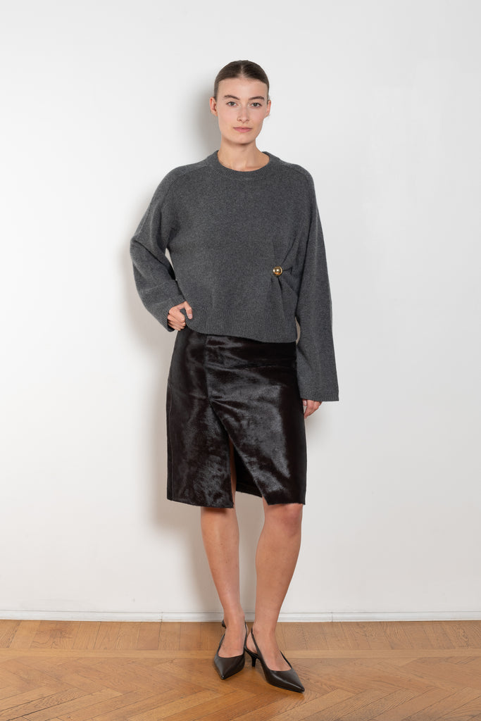 The Bill Sweater by Loulou Studio is thick soft cashmere sweater with a draped detail and an hardware embellishment