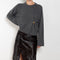 The Bill Sweater by Loulou Studio is thick soft cashmere sweater with a draped detail and an hardware embellishment