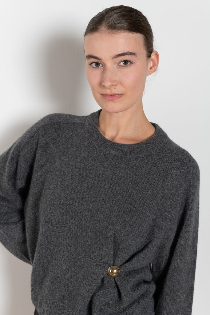 The Bill Sweater by Loulou Studio is thick soft cashmere sweater with a draped detail and an hardware embellishment