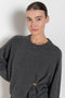 The Bill Sweater by Loulou Studio is thick soft cashmere sweater with a draped detail and an hardware embellishment