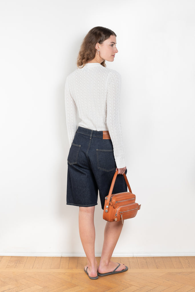 The Isu Short by Loulou Studio is a mid rise jeans short with bermuda-like proportions