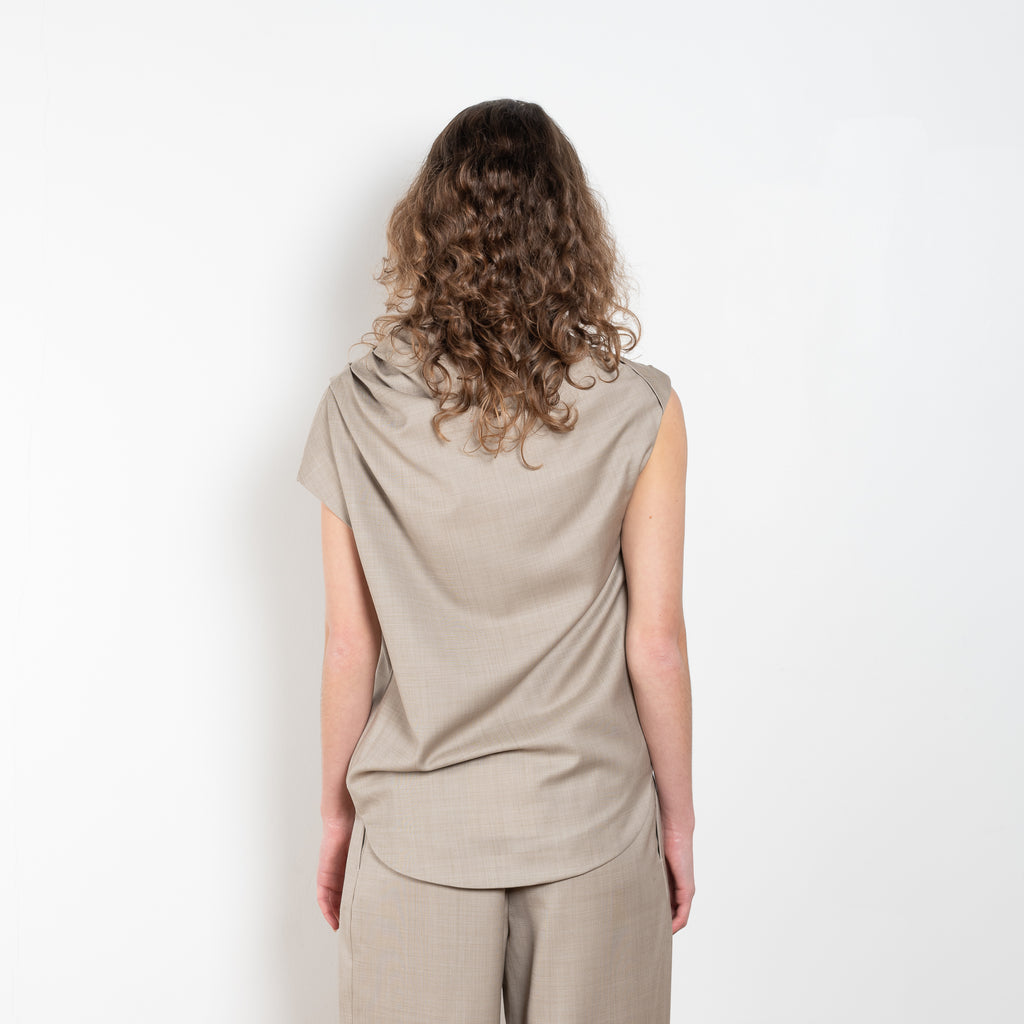 The Lyra Top by Loulou Studio is a sleeveless top with draped details in a lightweight virgin wool