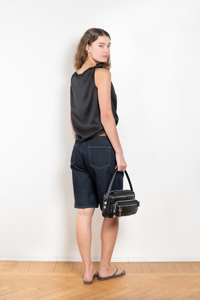 The Remy Top by Loulou Studio is a cotton silk twill top with a drape knot detail on the shoulders