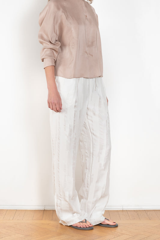 The Soler Trouser by Loulou Studio are textured brushed trousers made of a silk cotton blend with a straight relaxed fit