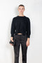 The Mora Sweater by Loulou Studio is a&nbsp;high round neck sweater with side slits and cropped sleeves