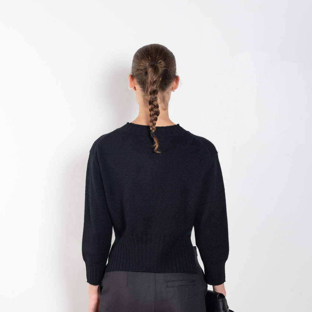 The Mora Sweater by Loulou Studio is a&nbsp;high round neck sweater with side slits and cropped sleeves