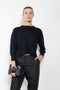 The Mora Sweater by Loulou Studio is a&nbsp;high round neck sweater with side slits and cropped sleeves