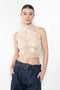 The Crochet Lace Top by Magda Butrym is a cropped top with a high neck and an all-over floral design in traditional Polish crochet technique