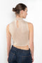 The Crochet Lace Top by Magda Butrym is a cropped top with a high neck and an all-over floral design in traditional Polish crochet technique
