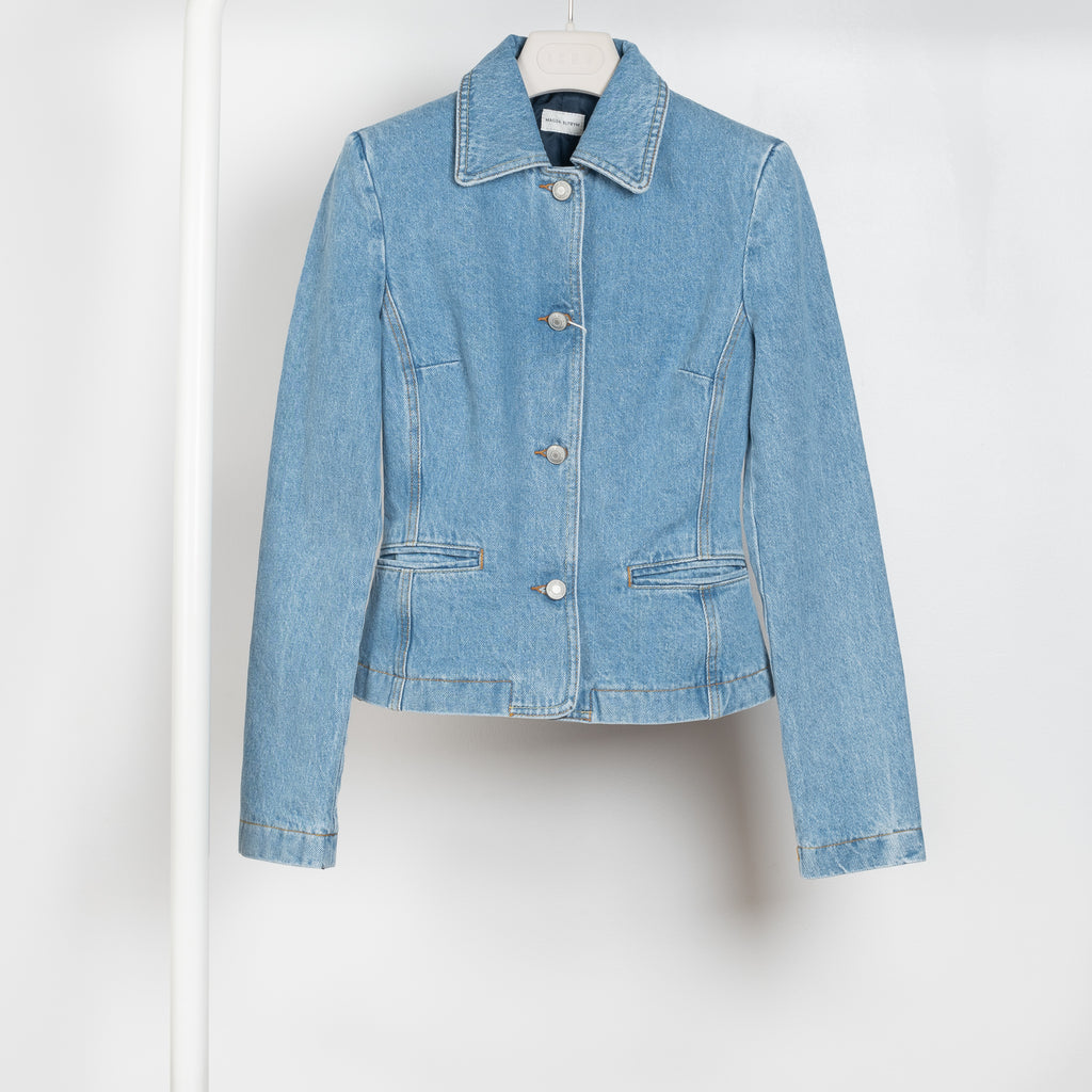 The Denim Blazer by Magda Butrym is a signature fitted denim jacket in a structured cotton with a peplum fit