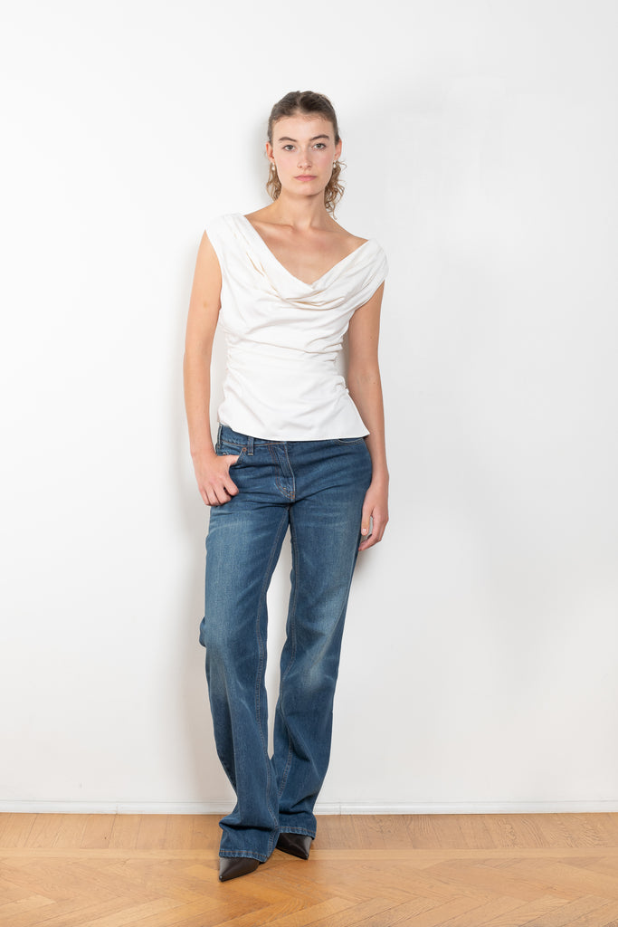 The Flare Denim by Magda Butrym is a low waist, rigid cotton denim with elongated flare legs