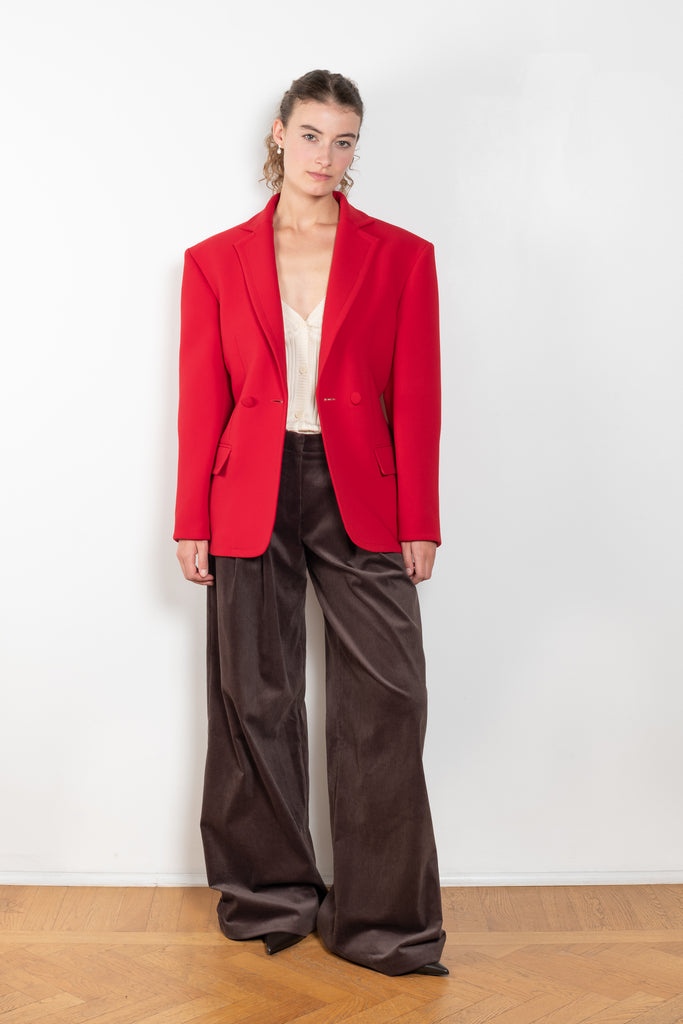 The Hourglass Blazer by Magda Butrym is an oversized hourglass blazer with boxy shoulders and an adjustable, cinched waist