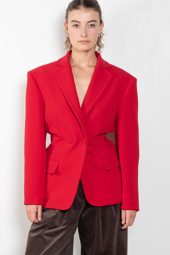 The Hourglass Blazer by Magda Butrym is an oversized hourglass blazer with boxy shoulders and an adjustable, cinched waist