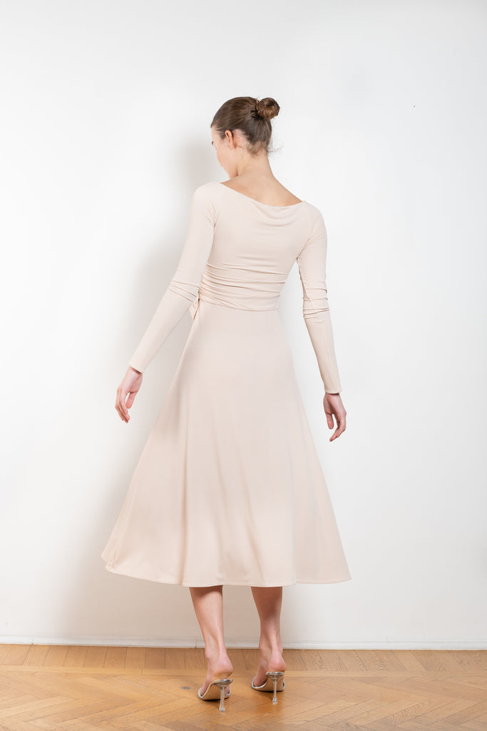 The Jersey Wrap Dress 21 by Magda Butrym is an elegant wrap dress with a v neck ballerina neckline, long off the shoulder sleeves, and an a-line midi skirt