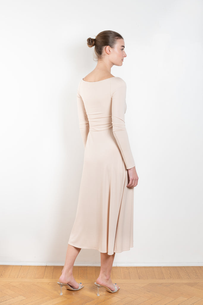 The Jersey Wrap Dress 21 by Magda Butrym is an elegant wrap dress with a v neck ballerina neckline, long off the shoulder sleeves, and an a-line midi skirt