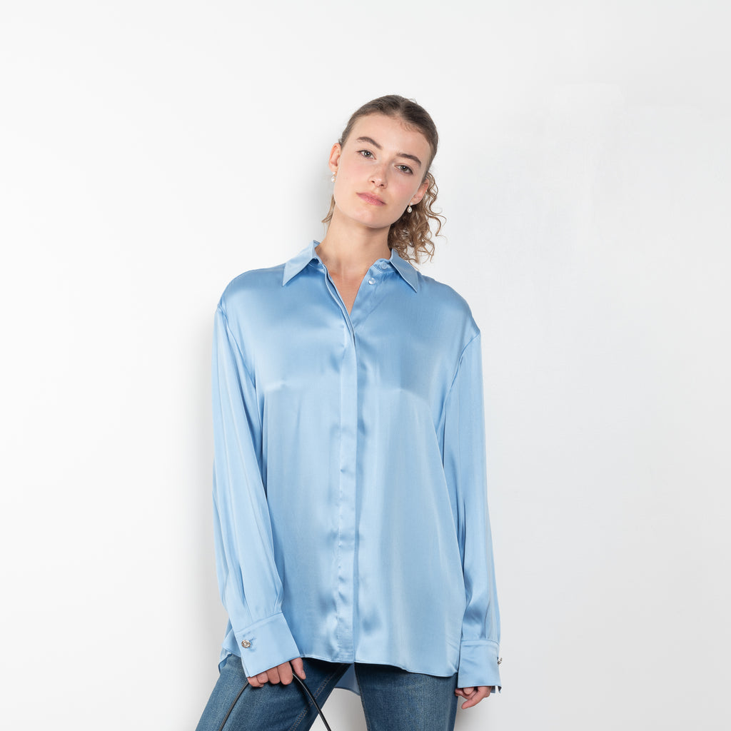 The Silk Shirt by Magda Butrym is a classic button down blouse done in silk with a flowy silhouette