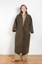 The Parka Coat Oil by Maud Van Den Beussche is a long parka in a structured cotton with detachable hood