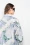 The Boule Shirt by Meryll Rogge is an oversized shirt with a ruffled details on the back in a seasonal floral print