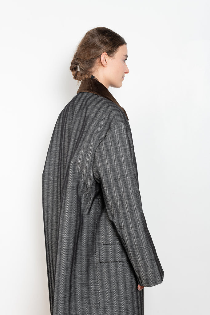 The Corduroy Collar Coat by Meryll Rogge is an oversized cotton coat with an exaggerated shoulder line and a corduroy collar