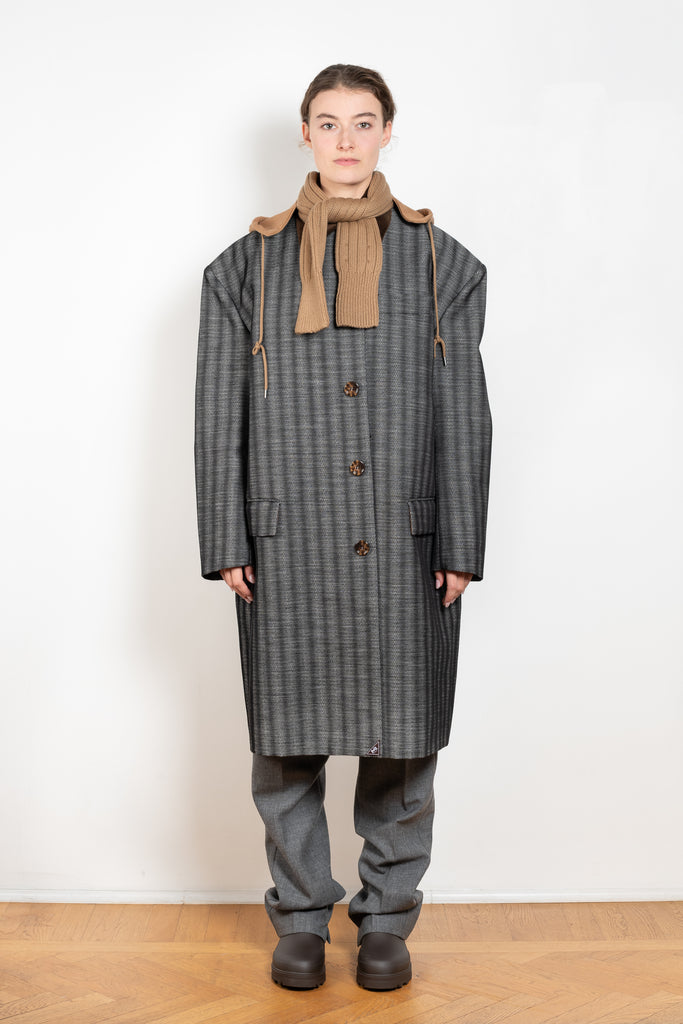 The Corduroy Collar Coat by Meryll Rogge is an oversized cotton coat with an exaggerated shoulder line and a corduroy collar