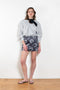 The Daisy Scuba Mini Skirt by Meryll Rogge is a fitted short skirt in a floral embroidery scuba fabric