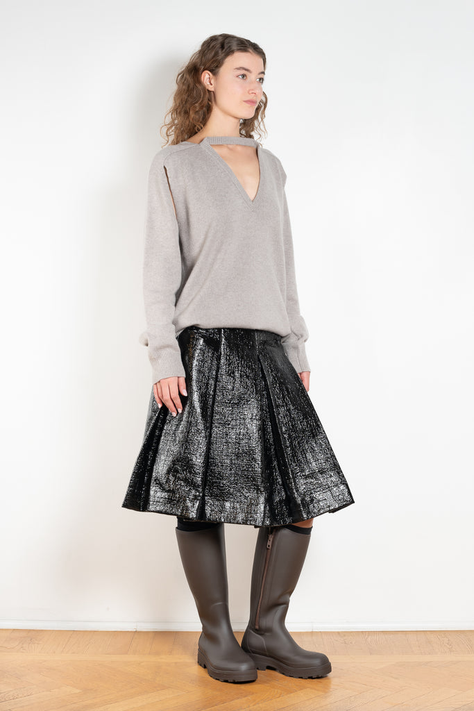 The Lacquered Pleated Skirt by Meryll Rogge is mid waist pleated skirt in lacquered coated cotton