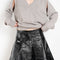 The Lacquered Pleated Skirt by Meryll Rogge is mid waist pleated skirt in lacquered coated cotton