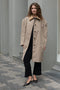 The Mac Coat by Meryll Rogge is an oversized cotton coat with an exaggerated shoulder line and a corduroy collar