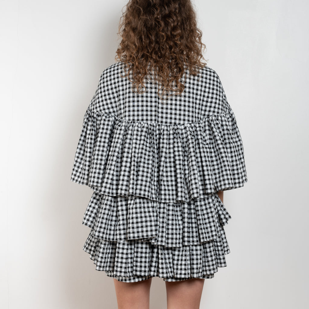 The Short Ruffle Dress by Meryll Rogge is a short dress with a vichy print and cute ruffles